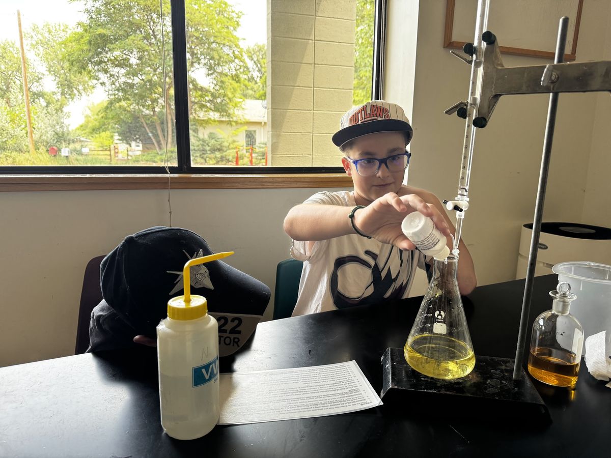 Student running a water quality titration in the lab